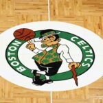 The Boston Celtics logo is seen on the parquet floor at center court before the game between the Boston Celtics and the Washington Wizards at TD Garden.