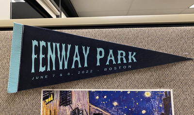 A baseball pennant says “Fenway Park.”