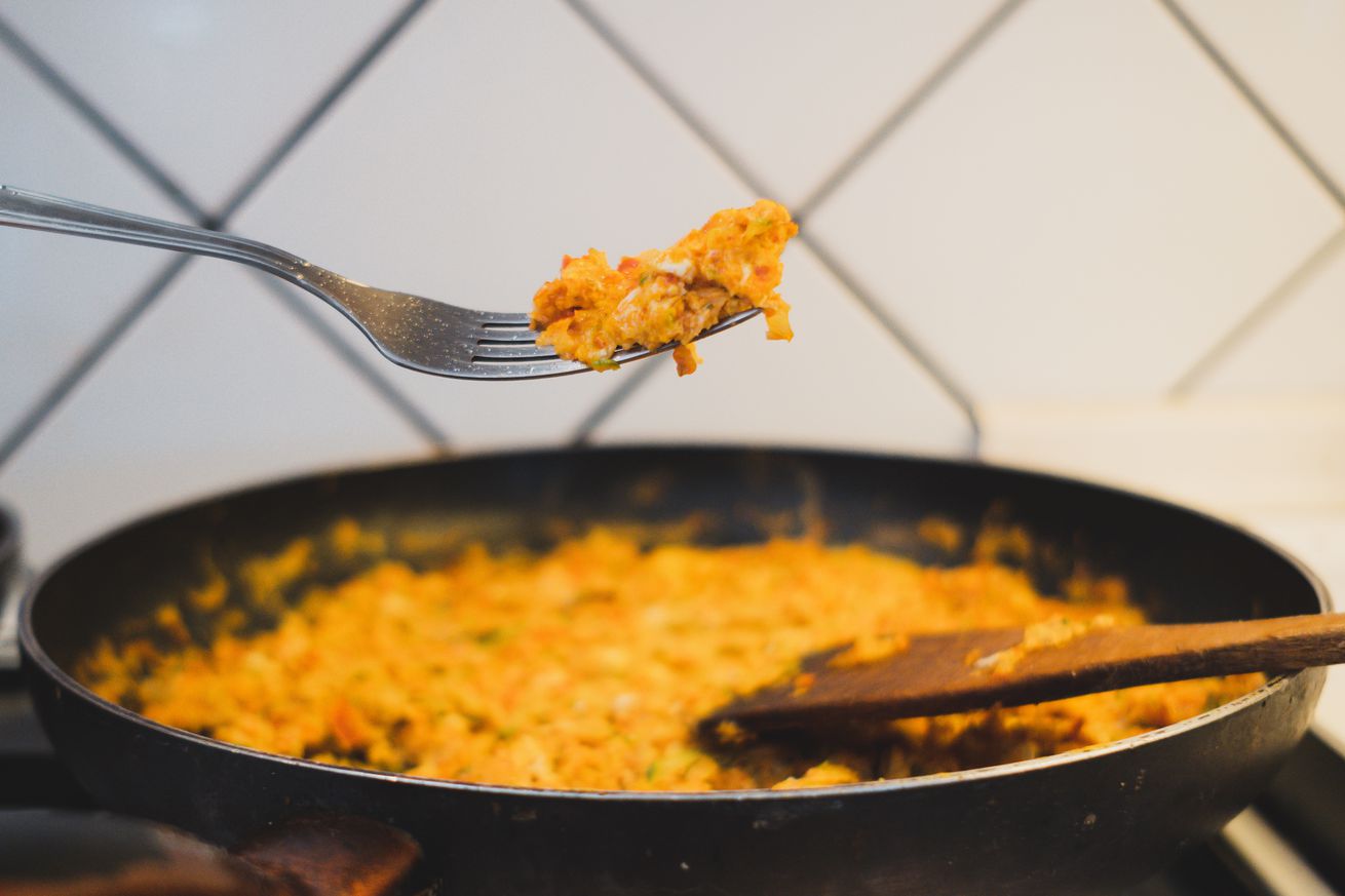 Cooking Scrambled Eggs With Sausages In Chania