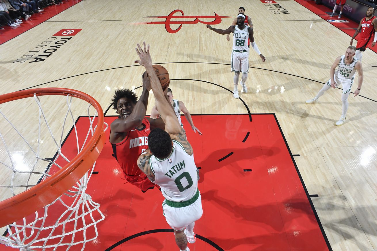 Boston Celtics star Jayson Tatum defends the rim against the Houston Rockets.